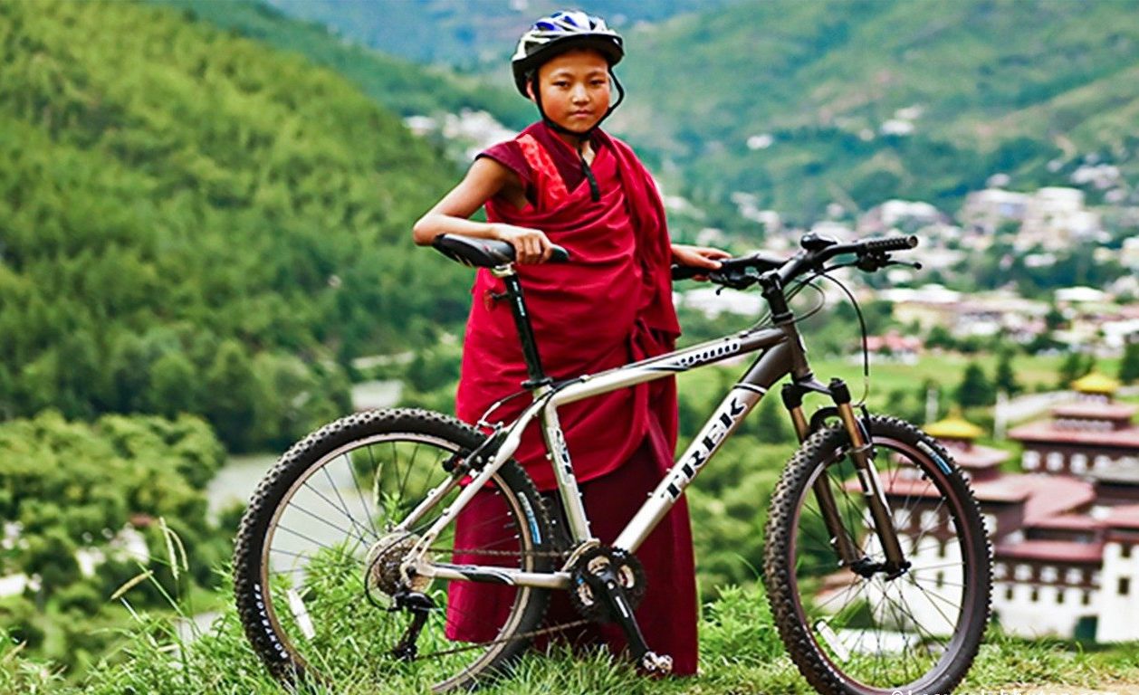 Travel-Bhutan-on-Bike-Little-Monk-on-Cycle